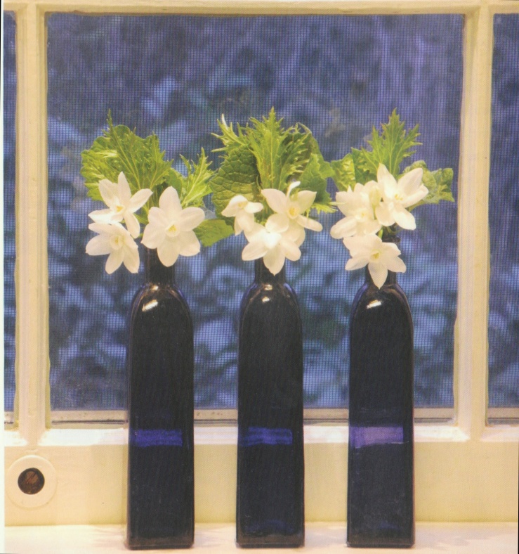 Blue bottles, white flowers